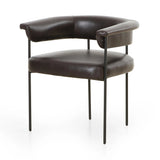 Featuring Carrie Sonoma Black Dining Chair by Four Hands at Amethyst Home. Airy and light with slim, black-finished iron framing, slate-colored performance boucle lends texture to a beautifully sculpted dining style featuring a yoke back and exterior fold detailing. Easy to clean and made from fully recyclable materials, Fiqa fabrics are machine-washable, stain. Amethyst Home provides interior design, new home construction design consulting, vintage area rugs, and lighting in the Omaha metro area.