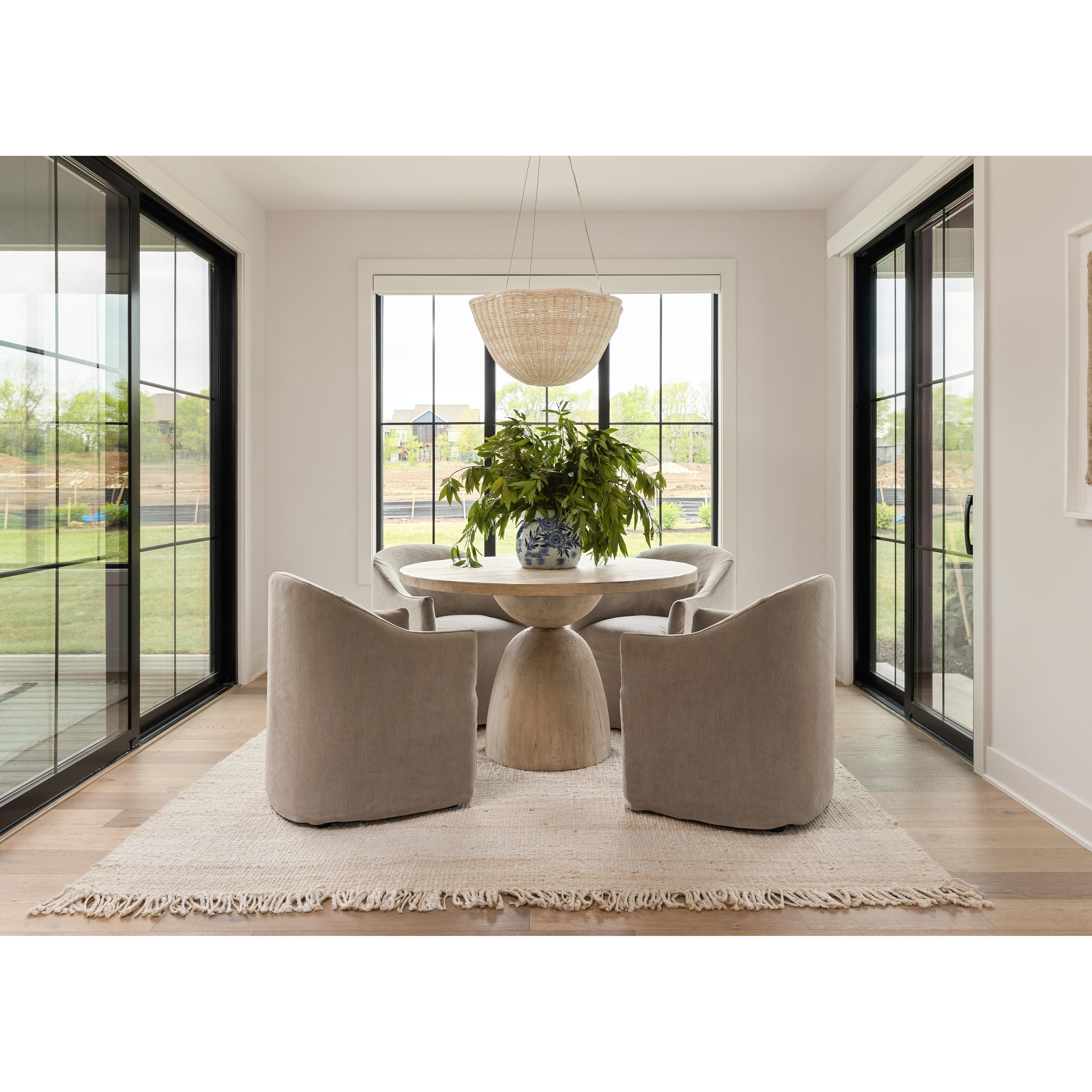 Introducing the Cove Heather Twill Stone Dining Chair, a stylish and feminine update to the traditional barrel chair. The heather twill adds texture and elegance to the design, making it the perfect addition to any modern coastal-inspired home design. Paired with Surya rugs, this chair will transform your dining room into a cozy and inviting space. Whether you're in Nashville, Florida, or Utah, this chair is a must-have for any home design that values both style and comfort.
