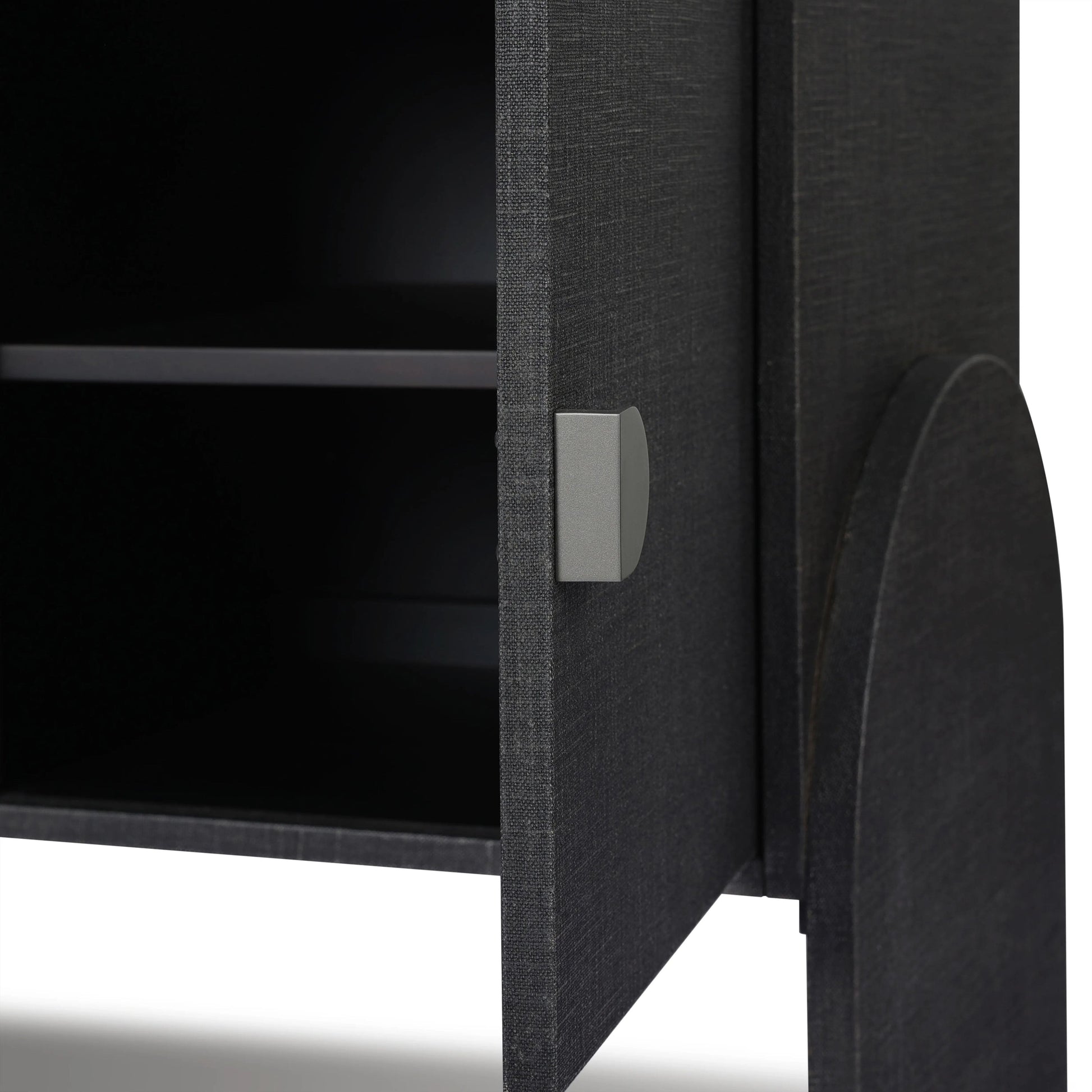 Talk about novelty. Made from painted black linen, arched legs soften otherwise clean, modern shaping. Gunmetal, half-moon iron hardware completes the look. Rear cutouts for cord management Amethyst Home provides interior design, new home construction design consulting, vintage area rugs, and lighting in the Newport Beach metro area.