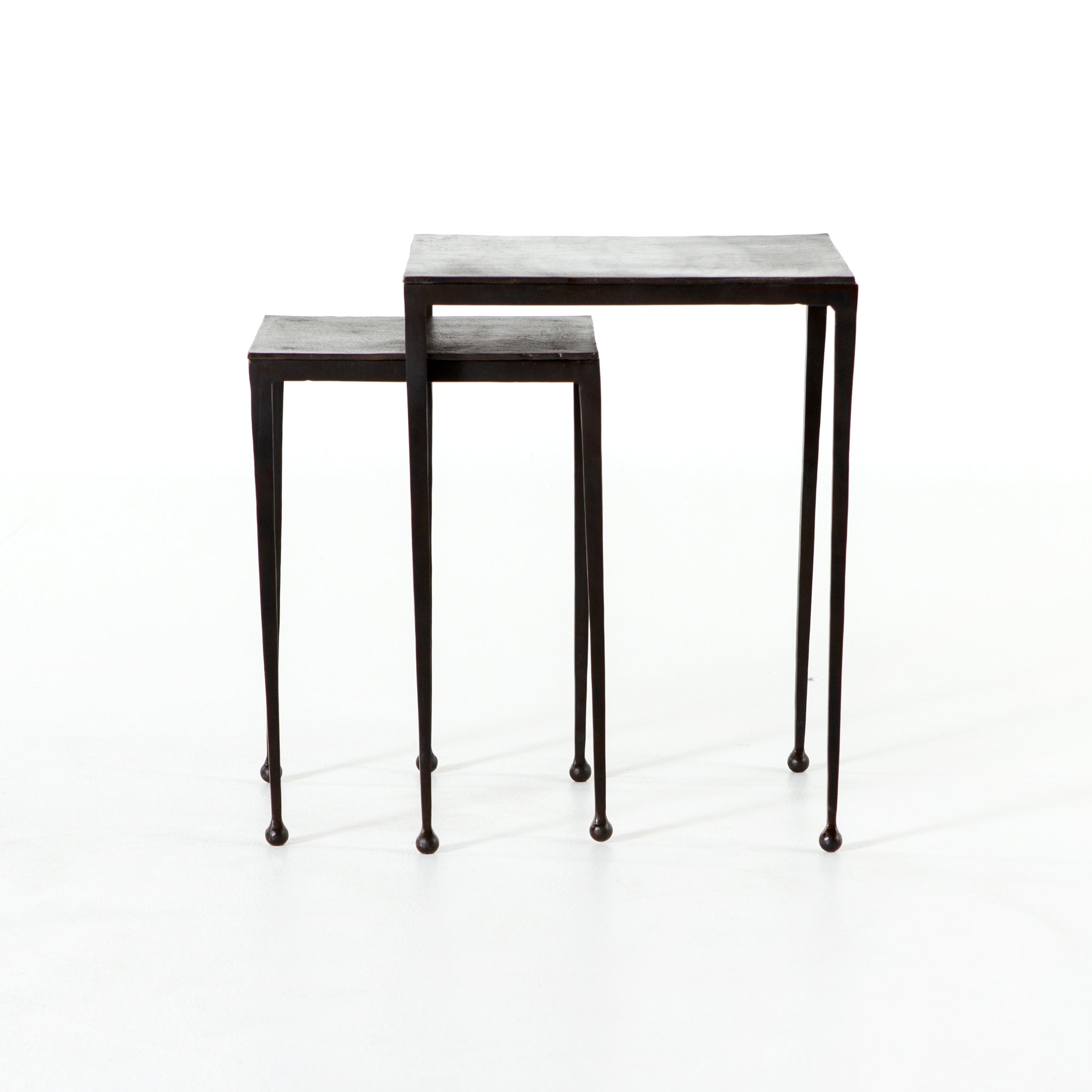 Featuring Dalston Antique Rust Nesting End Tables by Four Hands at Amethyst Home. Slender styling adopts depth from swirls of antique tones. Tapered legs with rounded feet bring balanced footing to streamlined shaping. Aluminum tops are squared-off and finished in a rich rust. Â  Large nesting table measures 16"W x 21.25"H. Small table measures 12.5"W x 18.25"H.
Collection: Marlo. Amethyst Home provides interior design, new construction, custom furniture, and area rugs in the Park City metro area.