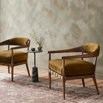 Featuring Dane Cottswald Moss Nubuck Chair by Four Hands at Amethyst Home. Safari styling is brought to modern speed on this vintage-inspired chair. Its solid wood frame features a webbed seating structure that brings a sink-in feel to the entire piece. The upholstered back, strap details and loose cushion are finished in a rich Italian-made leather with a soft, buttery feel and sub. Amethyst Home provides interior design, new construction, custom furniture, and area rugs in the Austin metro area.