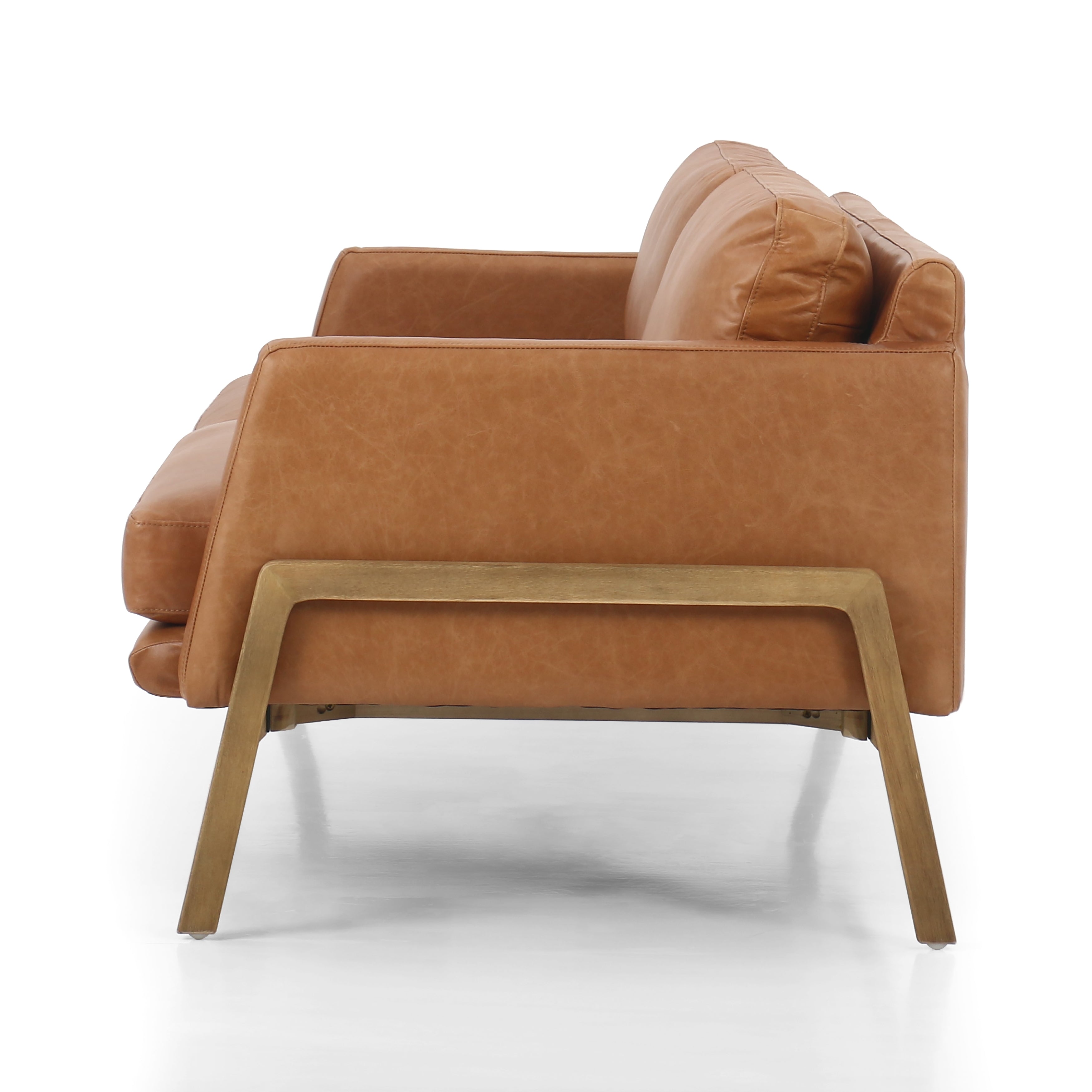 Featuring Diana Sonoma Butterscotch Sofa by Four Hands at Amethyst Home. Buttery leather in a modern palette, the Diana sofa is charming and ultra comfy.  The wooden frame detail is an extra special touch.
Overall Dimensions: 84.00"w x 36.00"d x 32.00"h
Collection: KensingtonColors: Sonoma Butterscotch ,NaturalMaterials: Top Grain Leather ,Solid ParawoodOverall Dimensions: 84"W x. Amethyst Home provides interior design, new construction, custom furniture, and area rugs in the Charlotte metro area.