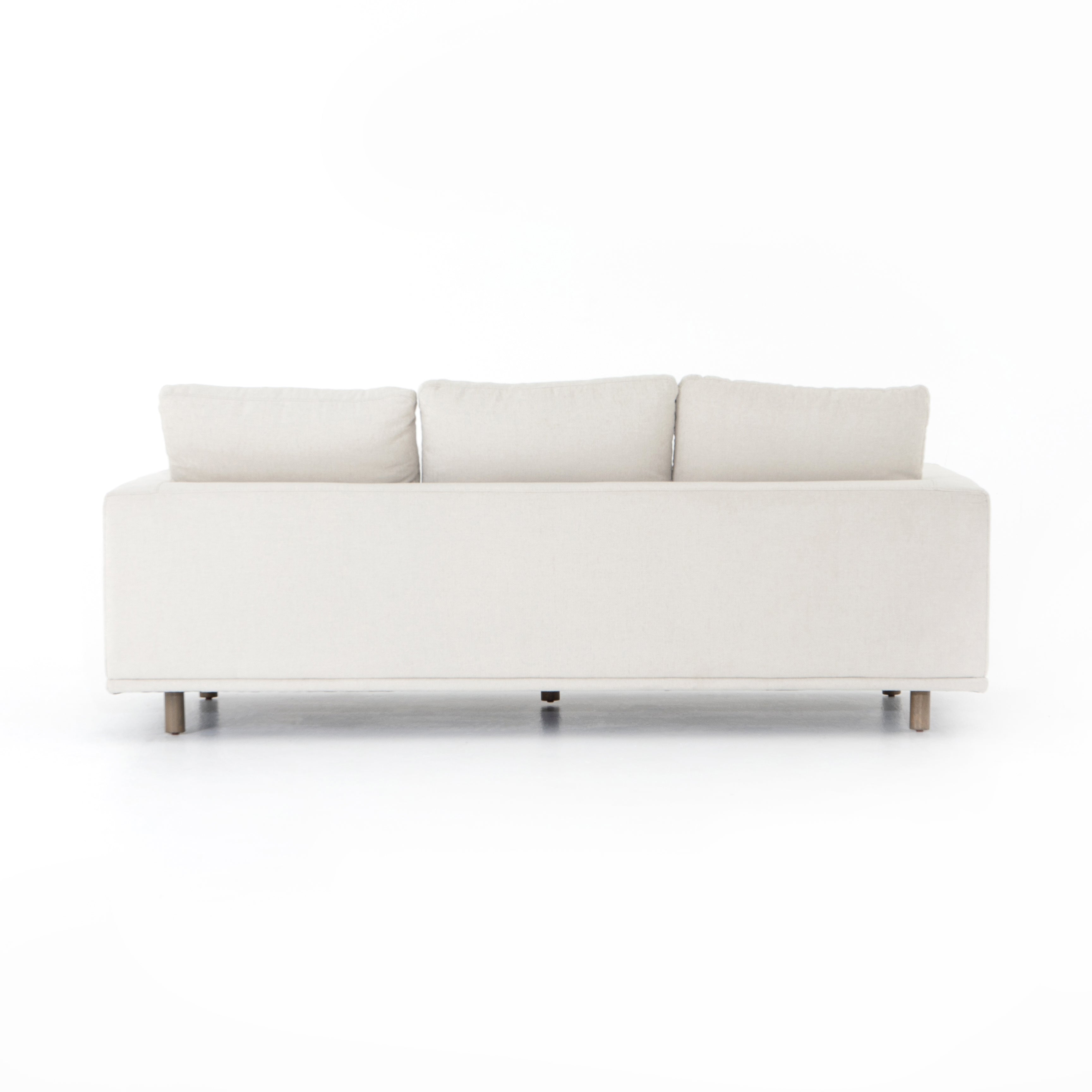 Performance-grade fabric brings surprising livability to a show-stopping silhouette. Pristinely tailored ivory upholstery exudes elegance, with clean track arms and loose feather-blend cushioning for total comfort. Cushions not reversible. Amethyst Home provides interior design, new construction, custom furniture, and area rugs in the Charlotte metro area.