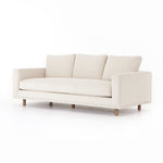 Performance-grade fabric brings surprising livability to a show-stopping silhouette. Pristinely tailored ivory upholstery exudes elegance, with clean track arms and loose feather-blend cushioning for total comfort. Cushions not reversible. Amethyst Home provides interior design, new construction, custom furniture, and area rugs in the Des Moines metro area.