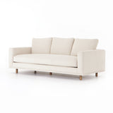 Performance-grade fabric brings surprising livability to a show-stopping silhouette. Pristinely tailored ivory upholstery exudes elegance, with clean track arms and loose feather-blend cushioning for total comfort. Cushions not reversible. Amethyst Home provides interior design, new construction, custom furniture, and area rugs in the Des Moines metro area.