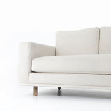 Performance-grade fabric brings surprising livability to a show-stopping silhouette. Pristinely tailored ivory upholstery exudes elegance, with clean track arms and loose feather-blend cushioning for total comfort. Cushions not reversible. Amethyst Home provides interior design, new construction, custom furniture, and area rugs in the Kansas City metro area.