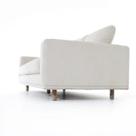 Performance-grade fabric brings surprising livability to a show-stopping silhouette. Pristinely tailored ivory upholstery exudes elegance, with clean track arms and loose feather-blend cushioning for total comfort. Cushions not reversible. Amethyst Home provides interior design, new construction, custom furniture, and area rugs in the Los Angeles metro area.