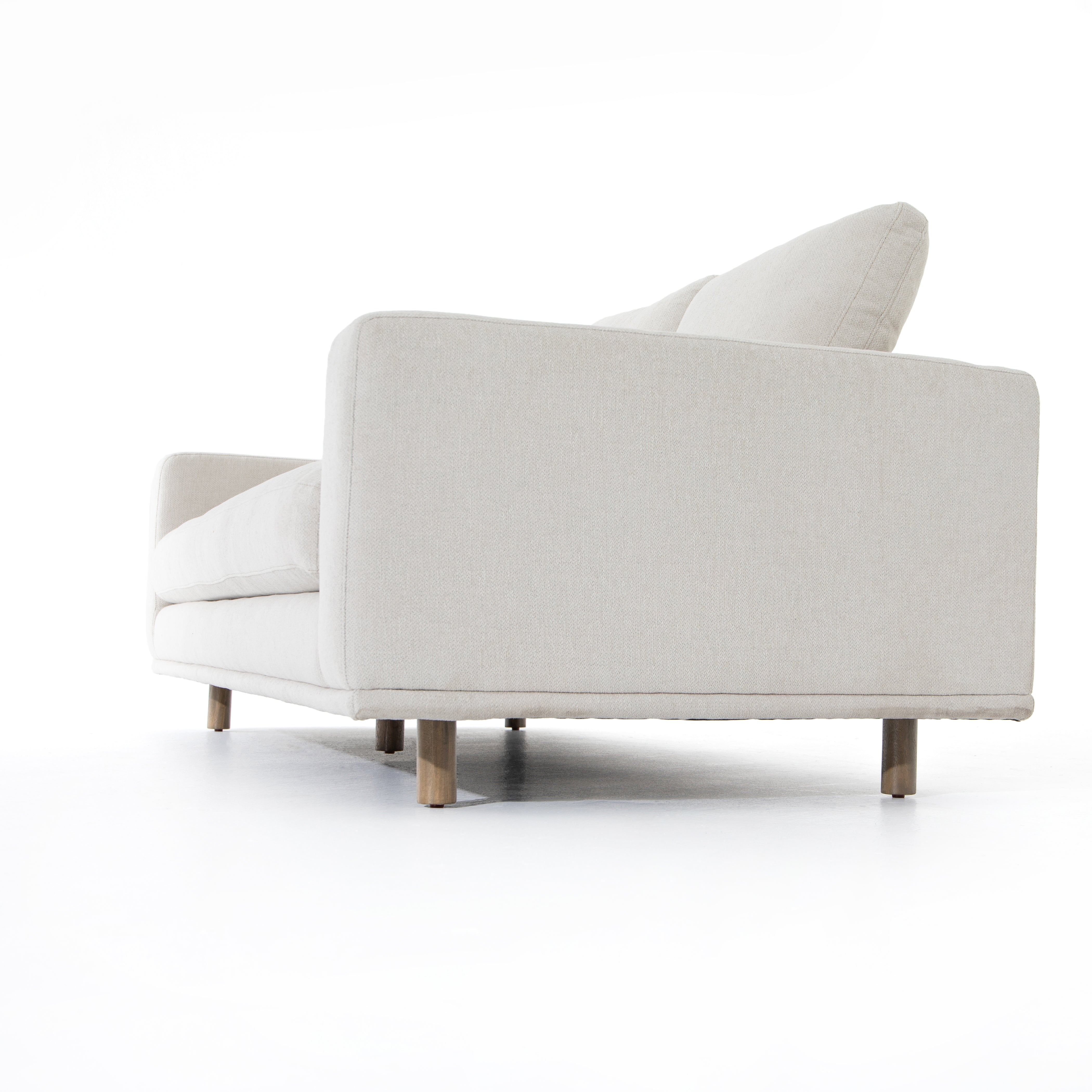 Performance-grade fabric brings surprising livability to a show-stopping silhouette. Pristinely tailored ivory upholstery exudes elegance, with clean track arms and loose feather-blend cushioning for total comfort. Cushions not reversible. Amethyst Home provides interior design, new construction, custom furniture, and area rugs in the Los Angeles metro area.