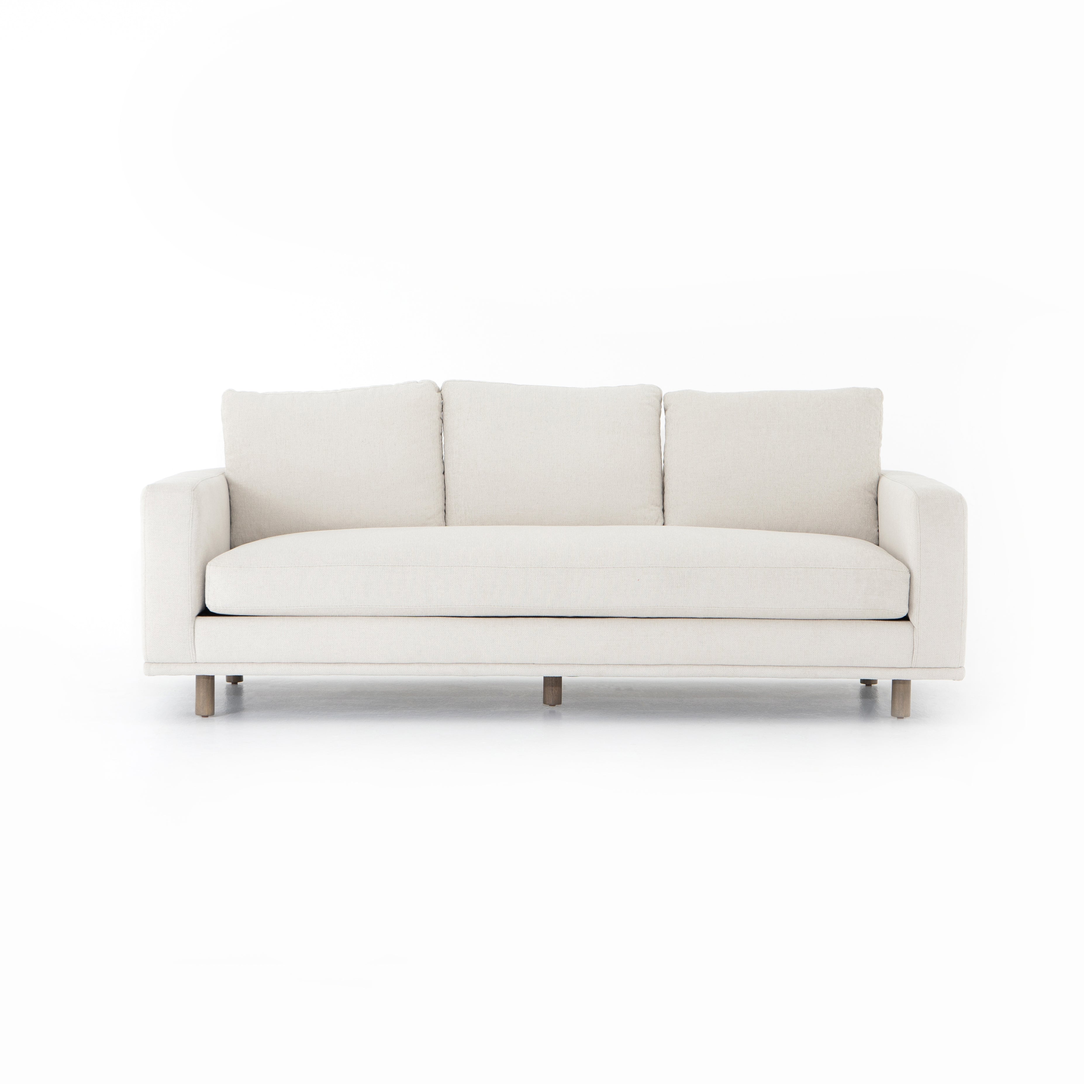 Performance-grade fabric brings surprising livability to a show-stopping silhouette. Pristinely tailored ivory upholstery exudes elegance, with clean track arms and loose feather-blend cushioning for total comfort. Cushions not reversible. Amethyst Home provides interior design, new construction, custom furniture, and area rugs in the Scottsdale metro area.