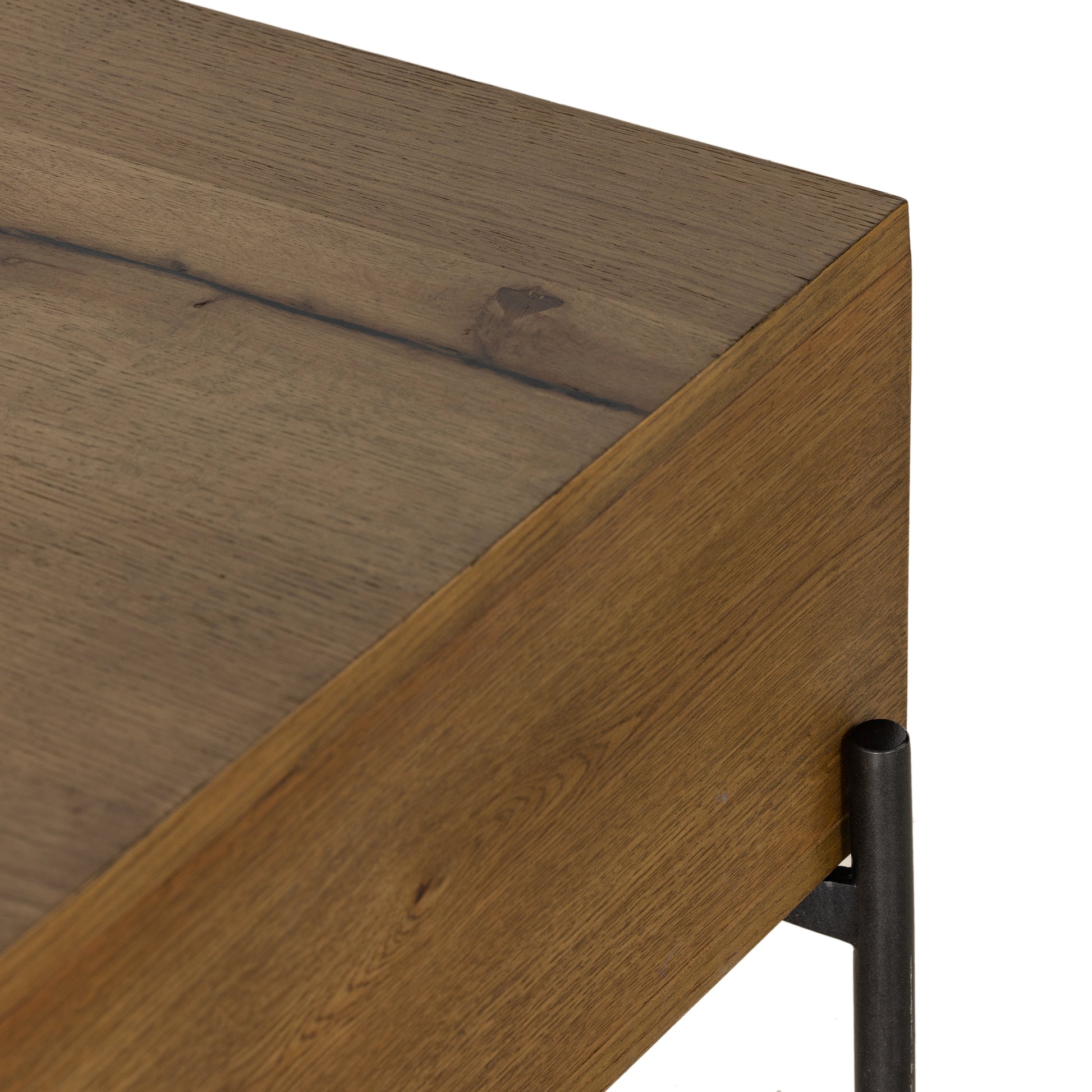 A slight cradle base of gunmetal-finished iron supports a clean-lined coffee table made from thick oak veneer, with dual drawers for extra storage space. For a rich, one-of-a-kind look, black resin fills woods' natural cracks and graining. A subtle variance of resin placement and amount is to be expected, and reflective of materials' character-rich roots. Amethyst Home provides interior design, new construction, custom furniture, and area rugs in the Portland metro area.