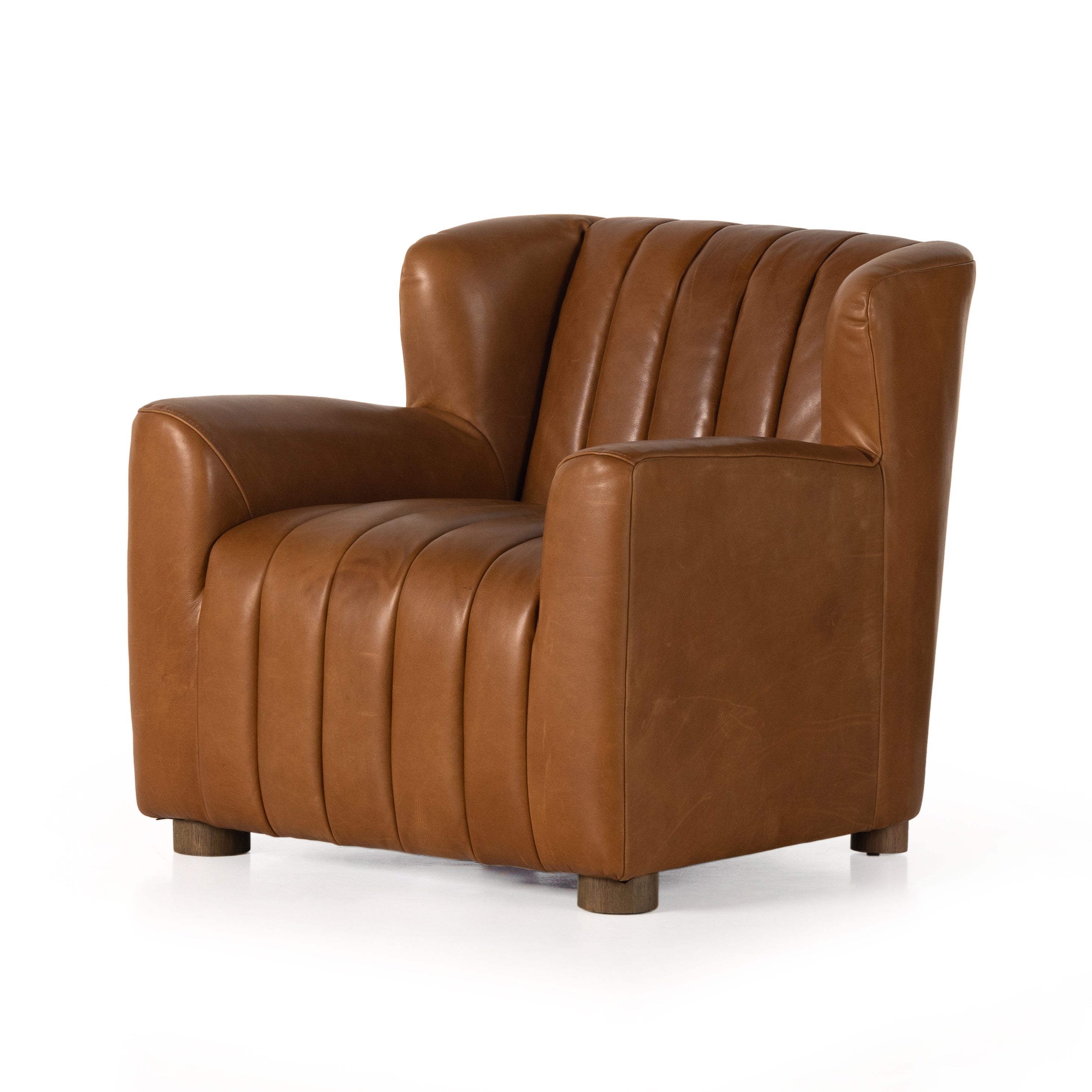 The classic wing-back club chair adopts heavy channeling for an even-comfier sit. Tobacco top-grain leather brings this retro lounge-inspired chair up to modern speed. Amethyst Home provides interior design, new construction, custom furniture, and area rugs in the Tampa metro area.