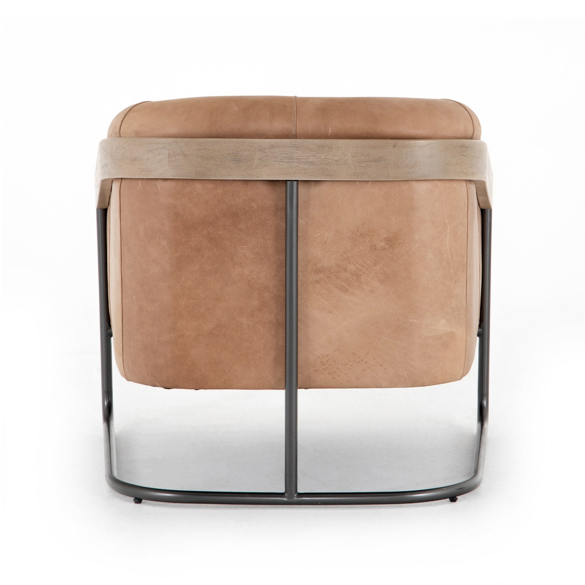 Deco-driven elegance. A fresh take on the traditional cigar chair, impeccably tailored tan top-grain leather forms a curvy U shape, with solid parawood detailing adding interest to gunmetal-finished iron framing. Amethyst Home provides interior design, new construction, custom furniture, and area rugs in the Park City metro area.