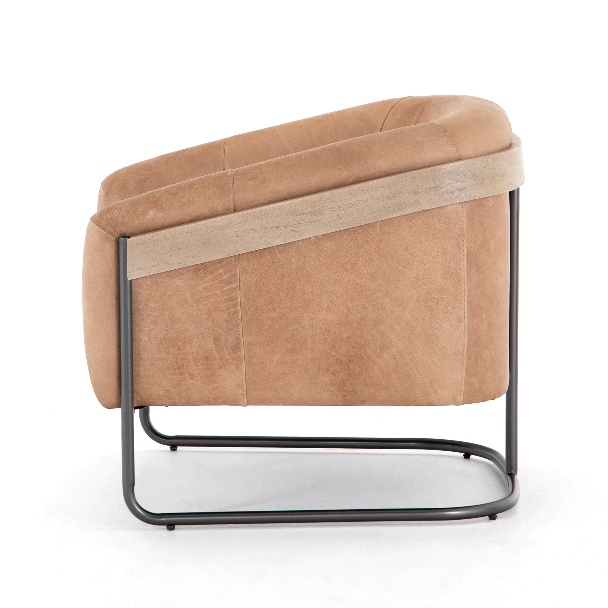Deco-driven elegance. A fresh take on the traditional cigar chair, impeccably tailored tan top-grain leather forms a curvy U shape, with solid parawood detailing adding interest to gunmetal-finished iron framing. Amethyst Home provides interior design, new construction, custom furniture, and area rugs in the Seattle metro area.