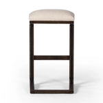 Featuring Finn Sienna Brown Oak Bar Stool by Four Hands at Amethyst Home. A stunner from every angle, this architecturally inspired stool features an angular base crafted from solid oak with two iron rods for added support and visual interest. Seat is upholstered in a linen/cotton/poly blend performance fabric with subtle texture throughout. Performance fabric. Amethyst Home provides interior design, new home construction design consulting, vintage area rugs, and lighting in the Dallas metro area.