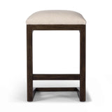 A stunner from every angle, this architecturally inspired stool features an angular base crafted from solid oak with two iron rods for added support and visual interest. Seat is upholstered in a linen/cotton/poly blend performance fabric with subtle texture throughout. Amethyst Home provides interior design, new home construction design consulting, vintage area rugs, and lighting in the Nashville metro area.