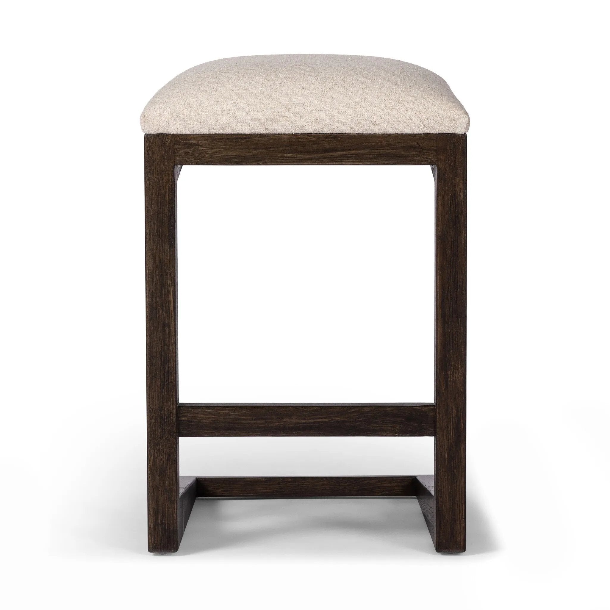 A stunner from every angle, this architecturally inspired stool features an angular base crafted from solid oak with two iron rods for added support and visual interest. Seat is upholstered in a linen/cotton/poly blend performance fabric with subtle texture throughout. Amethyst Home provides interior design, new home construction design consulting, vintage area rugs, and lighting in the Nashville metro area.