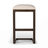 Featuring Finn Sienna Brown Oak Bar Stool by Four Hands at Amethyst Home. A stunner from every angle, this architecturally inspired stool features an angular base crafted from solid oak with two iron rods for added support and visual interest. Seat is upholstered in a linen/cotton/poly blend performance fabric with subtle texture throughout. Performance fab. Amethyst Home provides interior design, new home construction design consulting, vintage area rugs, and lighting in the Park City metro area.