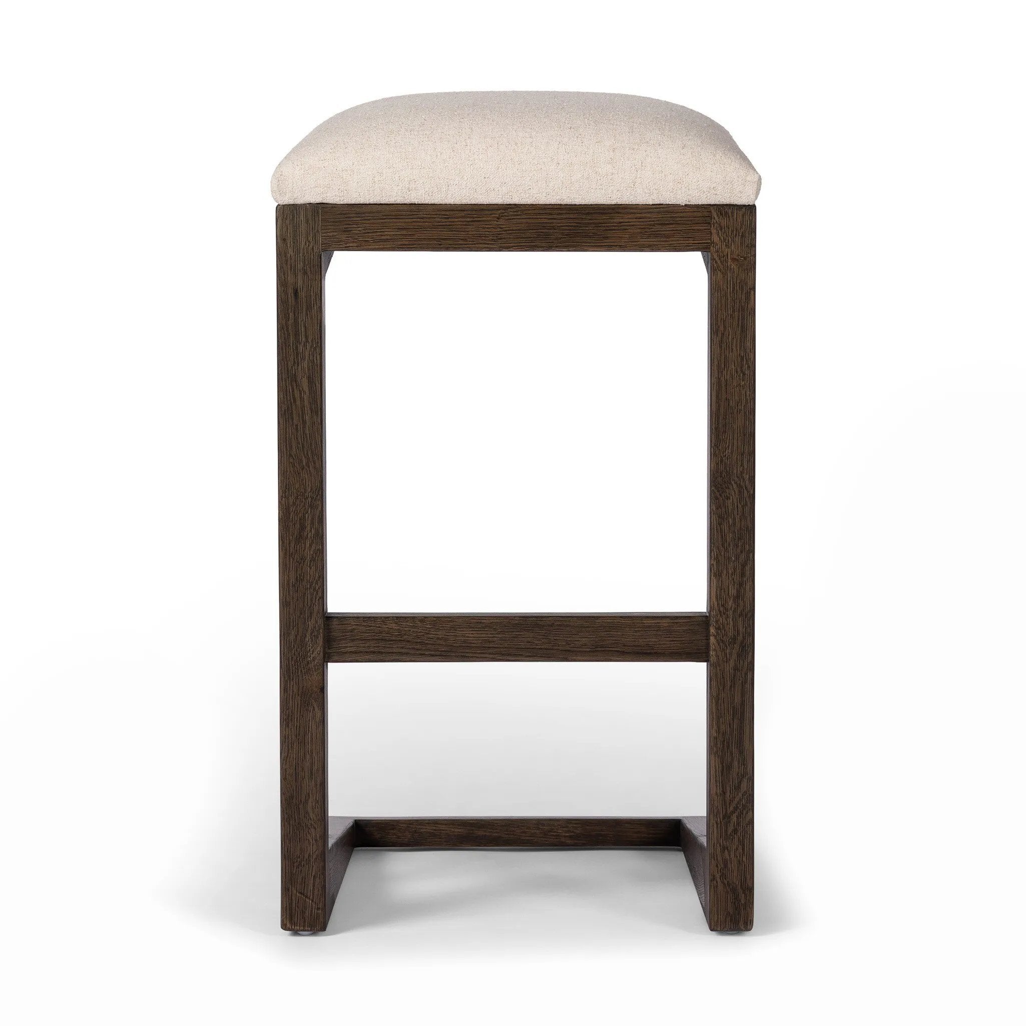 A stunner from every angle, this architecturally inspired stool features an angular base crafted from solid oak with two iron rods for added support and visual interest. Seat is upholstered in a linen/cotton/poly blend performance fabric with subtle texture throughout. Amethyst Home provides interior design, new home construction design consulting, vintage area rugs, and lighting in the Park City metro area.