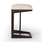 A stunner from every angle, this architecturally inspired stool features an angular base crafted from solid oak with two iron rods for added support and visual interest. Seat is upholstered in a linen/cotton/poly blend performance fabric with subtle texture throughout. Amethyst Home provides interior design, new home construction design consulting, vintage area rugs, and lighting in the Park City metro area.