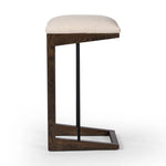 Featuring Finn Sienna Brown Oak Bar Stool by Four Hands at Amethyst Home. A stunner from every angle, this architecturally inspired stool features an angular base crafted from solid oak with two iron rods for added support and visual interest. Seat is upholstered in a linen/cotton/poly blend performance fabric with subtle texture throughout. Performanc. Amethyst Home provides interior design, new home construction design consulting, vintage area rugs, and lighting in the Salt Lake City metro area.