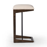 Featuring Finn Sienna Brown Oak Bar Stool by Four Hands at Amethyst Home. A stunner from every angle, this architecturally inspired stool features an angular base crafted from solid oak with two iron rods for added support and visual interest. Seat is upholstered in a linen/cotton/poly blend performance fabric with subtle texture throughout. Performanc. Amethyst Home provides interior design, new home construction design consulting, vintage area rugs, and lighting in the Salt Lake City metro area.