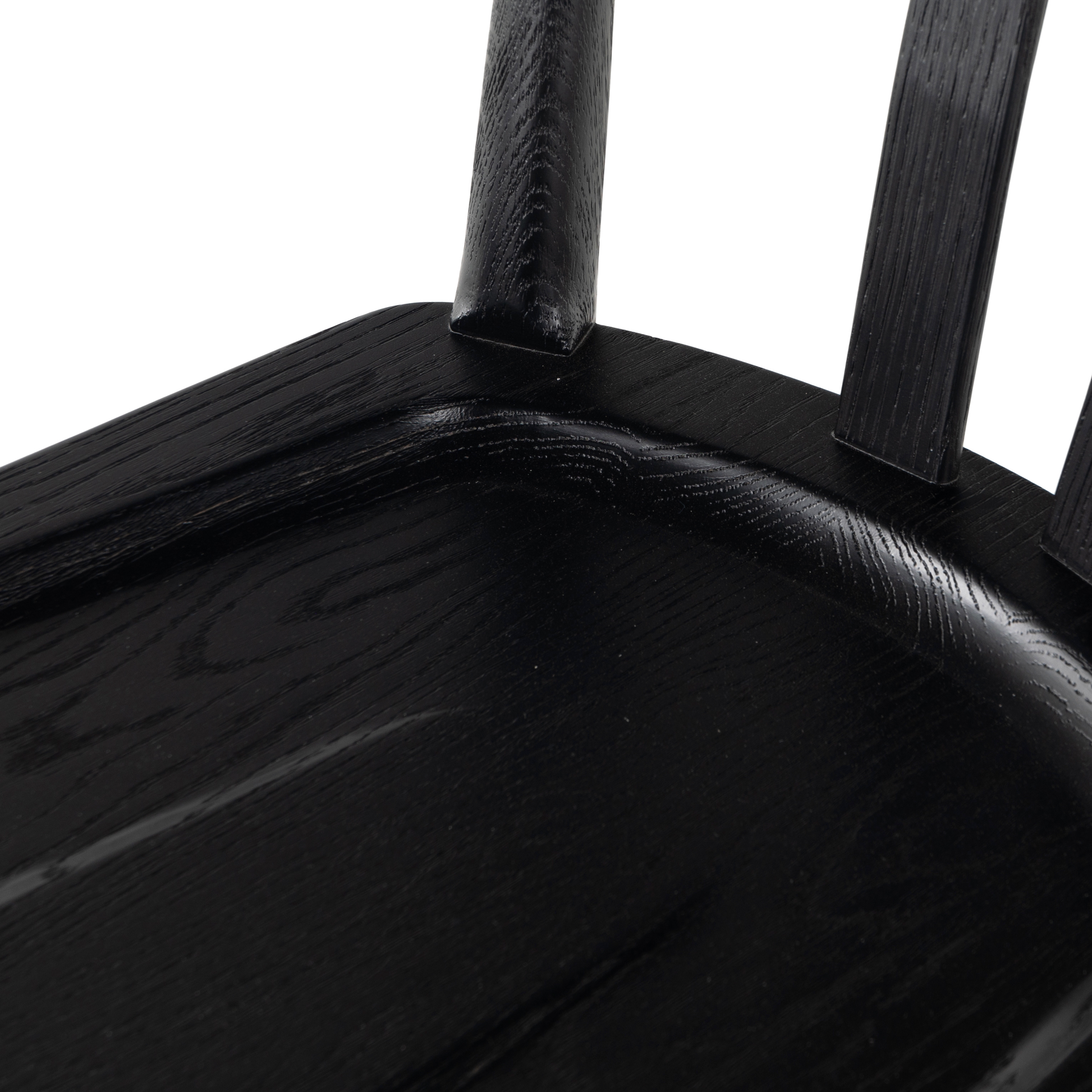 Finished in a beautifully classic black oak, the Gregory Black Oak Dining Chair features a yoke-like back and widened supports, placing a fresh twist on the traditional Windsor. Amethyst Home provides interior design, new construction, custom furniture, and rugs for the Boston metro area.