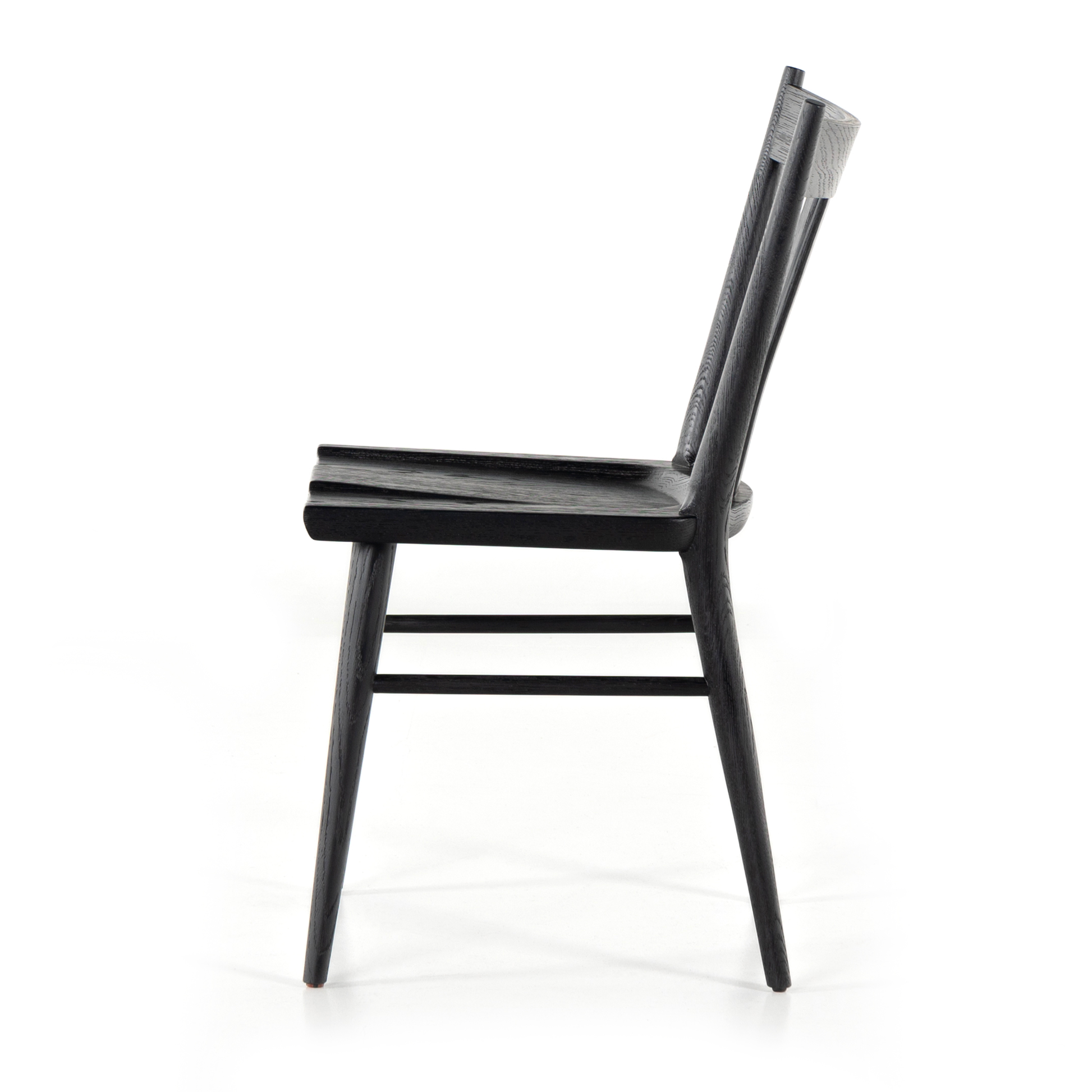 Finished in a beautifully classic black oak, the Gregory Black Oak Dining Chair features a yoke-like back and widened supports, placing a fresh twist on the traditional Windsor. Amethyst Home provides interior design, new construction, custom furniture, and rugs for the Dallas, Texas metro area.