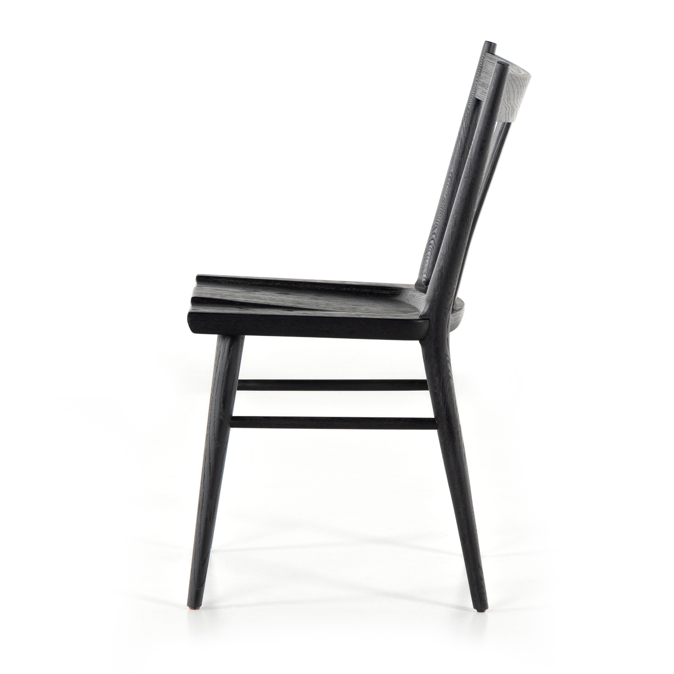 Finished in a beautifully classic black oak, the Gregory Black Oak Dining Chair features a yoke-like back and widened supports, placing a fresh twist on the traditional Windsor. Amethyst Home provides interior design, new construction, custom furniture, and rugs for the Dallas, Texas metro area.
