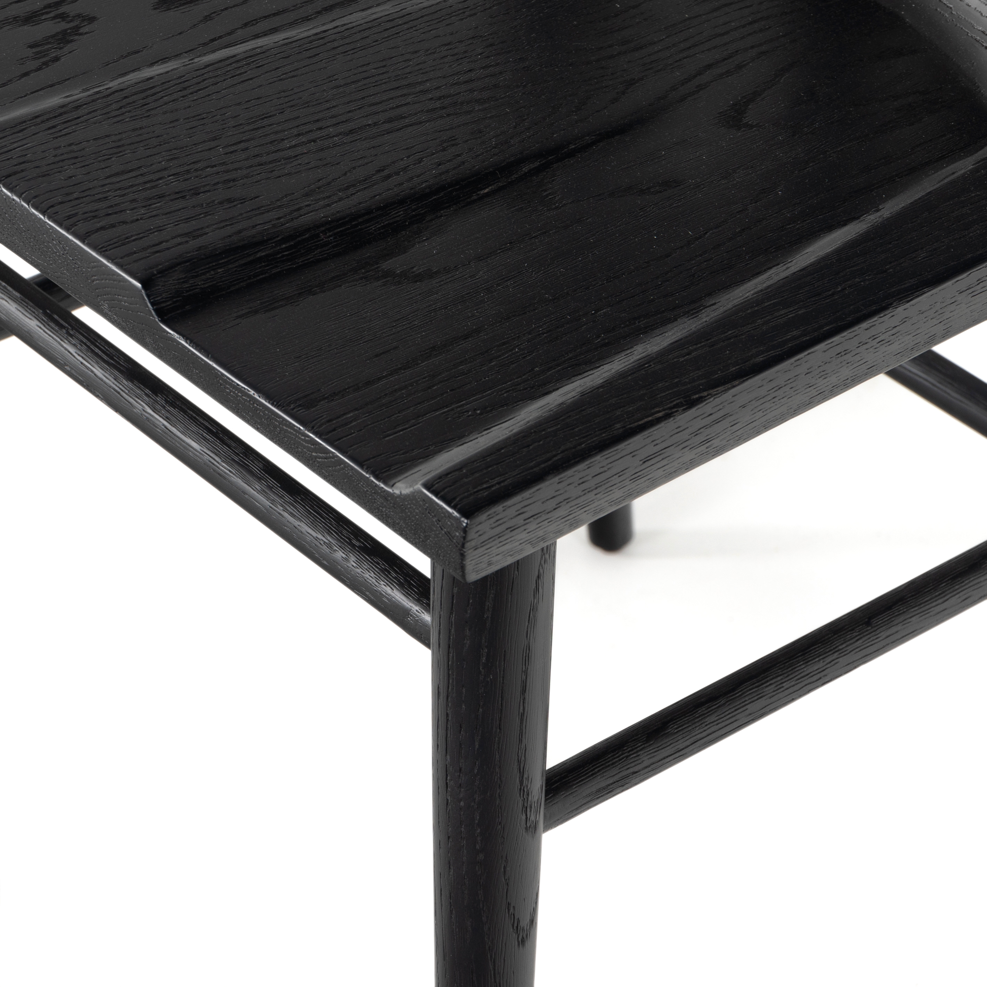 Finished in a beautifully classic black oak, the Gregory Black Oak Dining Chair features a yoke-like back and widened supports, placing a fresh twist on the traditional Windsor. Amethyst Home provides interior design, new construction, custom furniture, and rugs for the Lansing, Michigan metro area.