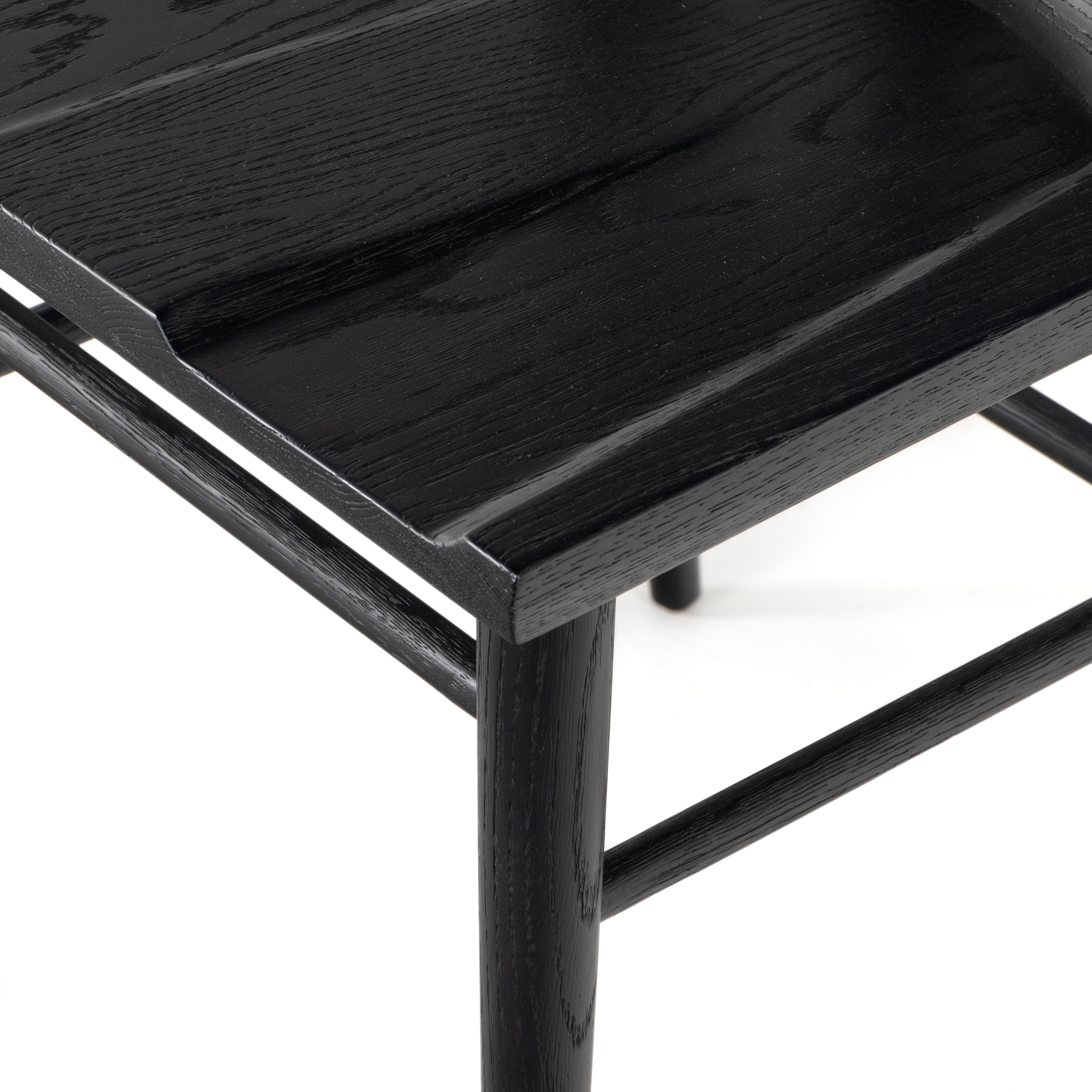 Finished in a beautifully classic black oak, the Gregory Black Oak Dining Chair features a yoke-like back and widened supports, placing a fresh twist on the traditional Windsor. Amethyst Home provides interior design, new construction, custom furniture, and rugs for the Lansing, Michigan metro area.