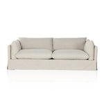 A slipcovered sofa made for modern living. Shelter arms and big, pillow-inspired cushions are covered in a durable comfortable fabric prime for lounging. Performance fabrics are specially created to withstand spills, stains, high traffic and wear, ensuring long-term comfort and unmatched durability. Amethyst Home provides interior design, new construction, custom furniture, and area rugs in the Charlotte metro area.