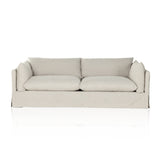 A slipcovered sofa made for modern living. Shelter arms and big, pillow-inspired cushions are covered in a durable comfortable fabric prime for lounging. Performance fabrics are specially created to withstand spills, stains, high traffic and wear, ensuring long-term comfort and unmatched durability. Amethyst Home provides interior design, new construction, custom furniture, and area rugs in the Charlotte metro area.