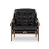 A Seventies-era style inspired by a flea market find, a dramatically tufted sling seat of black top-grain leather angles at the just-right pitch for total comfort, with wide, brown ash framing. Amethyst Home provides interior design, new home construction design consulting, vintage area rugs, and lighting in the Houston metro area.