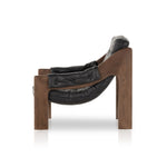 A Seventies-era style inspired by a flea market find, a dramatically tufted sling seat of black top-grain leather angles at the just-right pitch for total comfort, with wide, brown ash framing. Amethyst Home provides interior design, new home construction design consulting, vintage area rugs, and lighting in the Nashville metro area.