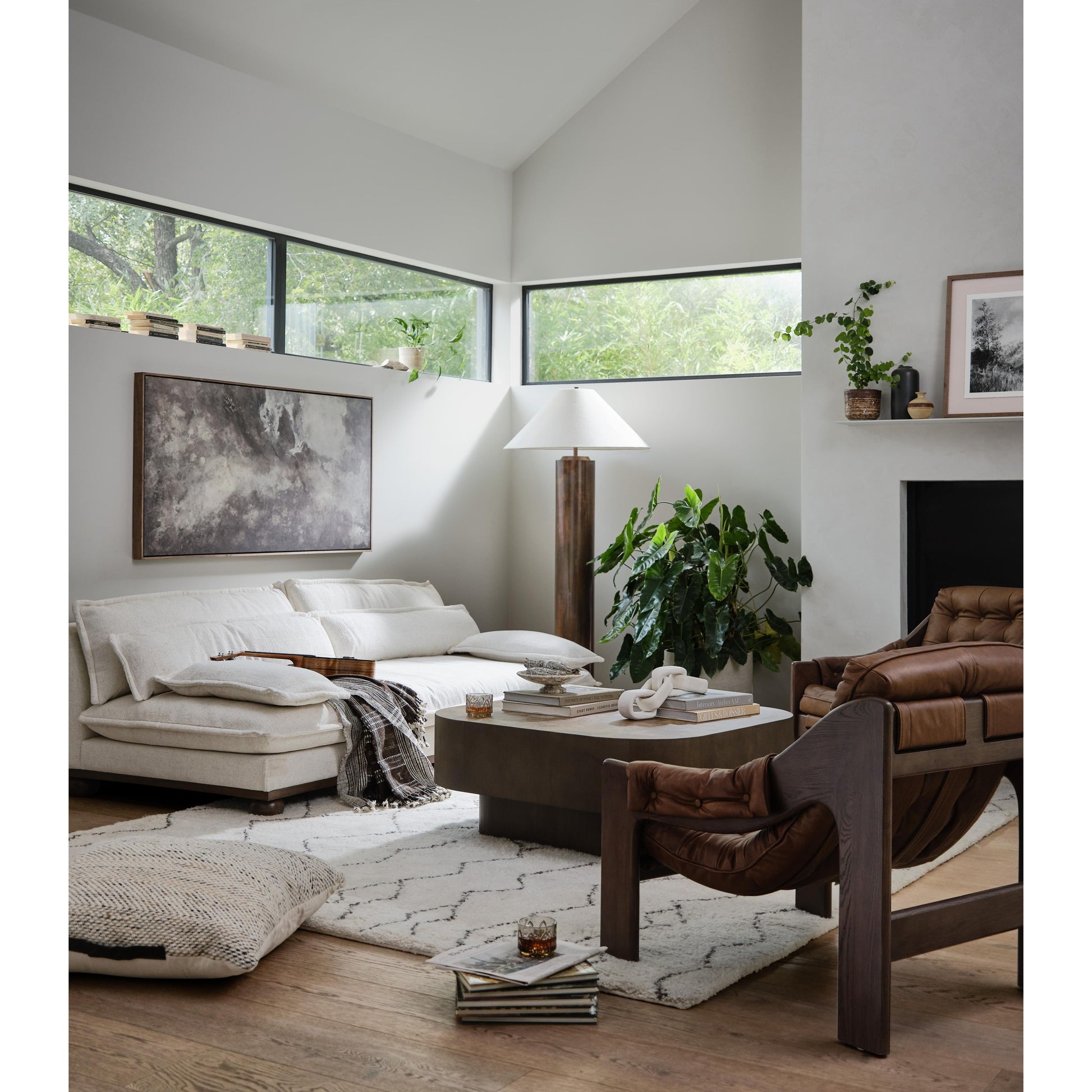 A Seventies-era style inspired by a flea market find, a dramatically tufted sling seat of black top-grain leather angles at the just-right pitch for total comfort, with wide, brown ash framing. Amethyst Home provides interior design, new home construction design consulting, vintage area rugs, and lighting in the Boston metro area.