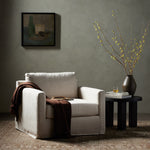 Featuring Hampton Creme Slipcover Swivel Chair by Four Hands at Amethyst Home. Proudly built by American makers using US-sourced materials and mechanisms. This classic swivel chair features clean track arms, a high, supportive back, feather filling and a 360-degree swivel. Upholstered with a fully removable slipcover of PFAS-free performance fabric that ca. Amethyst Home provides interior design, new home construction design consulting, vintage area rugs, and lighting in the Alpharetta metro area.