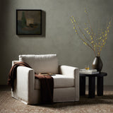 Featuring Hampton Creme Slipcover Swivel Chair by Four Hands at Amethyst Home. Proudly built by American makers using US-sourced materials and mechanisms. This classic swivel chair features clean track arms, a high, supportive back, feather filling and a 360-degree swivel. Upholstered with a fully removable slipcover of PFAS-free performance fabric that ca. Amethyst Home provides interior design, new home construction design consulting, vintage area rugs, and lighting in the Alpharetta metro area.