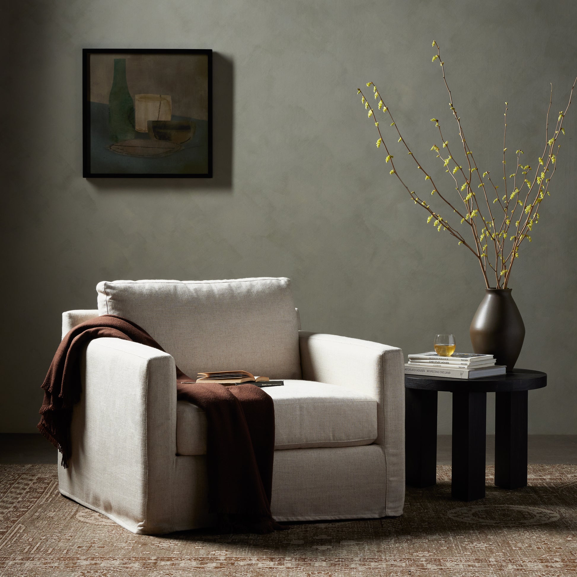 Proudly built by American makers using US-sourced materials and mechanisms. This classic swivel chair features clean track arms, a high, supportive back, feather filling and a 360-degree swivel. Upholstered with a fully removable slipcover of PFAS-free performance fabric that can be dry-cleaned for easy care. Amethyst Home provides interior design, new home construction design consulting, vintage area rugs, and lighting in the Alpharetta metro area.