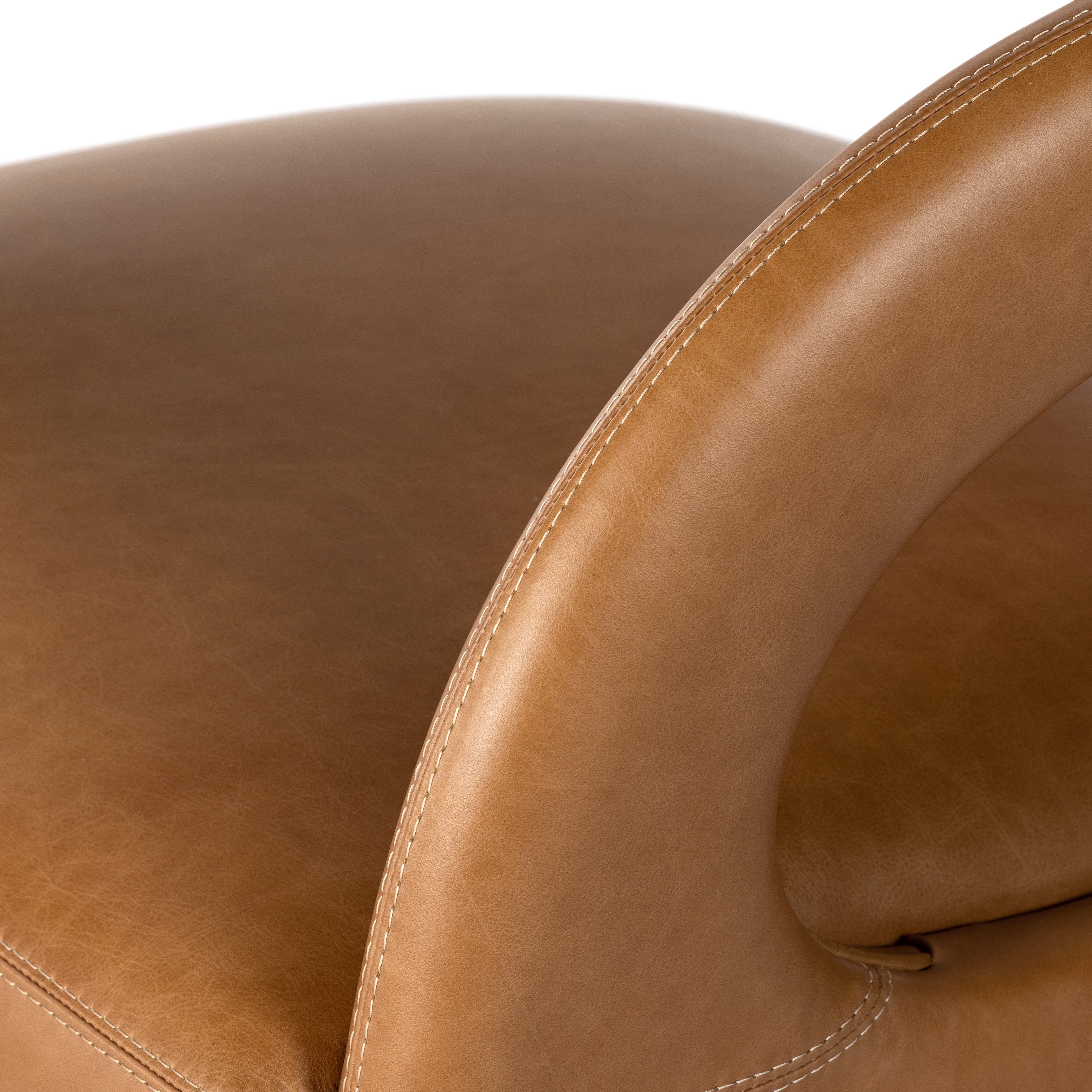 This 360-swivel update of the fan-favorite stationary design makes quite the statement. Well curved and finely sculpted, butterscotch-colored top-grain leather exclusive to Four Hands makes a uniquely shapely statement in any room. Amethyst Home provides interior design, new construction, custom furniture and area rugs in the Alpharetta metro area