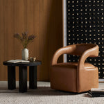 This 360-swivel update of the fan-favorite stationary design makes quite the statement. Well curved and finely sculpted, butterscotch-colored top-grain leather exclusive to Four Hands makes a uniquely shapely statement in any room. Amethyst Home provides interior design, new construction, custom furniture and area rugs in the Winter Garden metro area