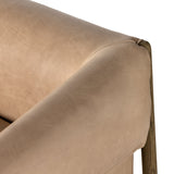 Sink right in. With slightly splayed legs for subtle intrigue, a tawny oak frame cradles comfy seating of top-grain leather in a nude hue, with wrapped arms for a cushioned look and feel. Amethyst Home provides interior design, new construction, custom furniture, and area rugs in the Charlotte metro area.