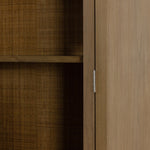 Ilana Burnished Mindi Cabinet forms a dramatic arch this glass-front cabinetry, with woven natural cane backing for a textural finishing touch. Amethyst Home provides interior design services, furniture, rugs, and lighting in the Kansas City metro area.
