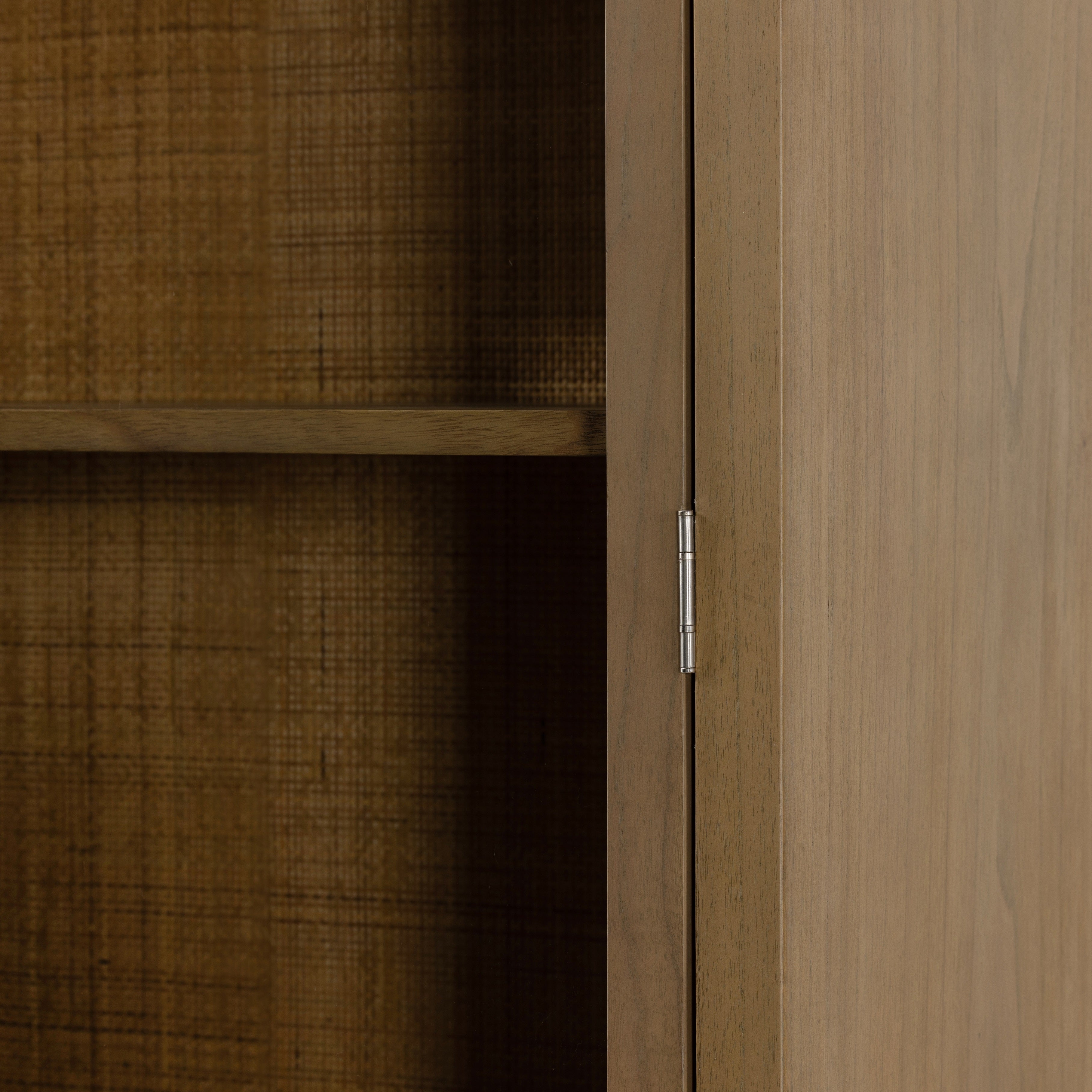 Ilana Burnished Mindi Cabinet forms a dramatic arch this glass-front cabinetry, with woven natural cane backing for a textural finishing touch. Amethyst Home provides interior design services, furniture, rugs, and lighting in the Kansas City metro area.