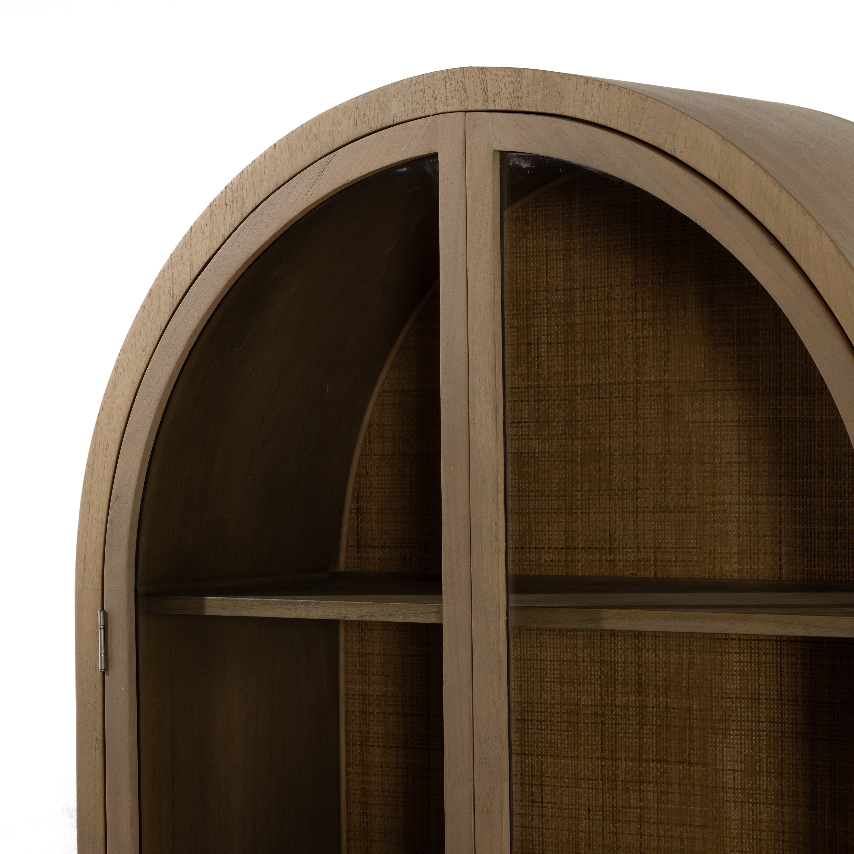 Ilana Burnished Mindi Cabinet forms a dramatic arch this glass-front cabinetry, with woven natural cane backing for a textural finishing touch. Amethyst Home provides interior design services, furniture, rugs, and lighting in the Seattle metro area.