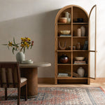 Ilana Burnished Mindi Cabinet forms a dramatic arch this glass-front cabinetry, with woven natural cane backing for a textural finishing touch. Amethyst Home provides interior design services, furniture, rugs, and lighting in the Winter Garden metro area.