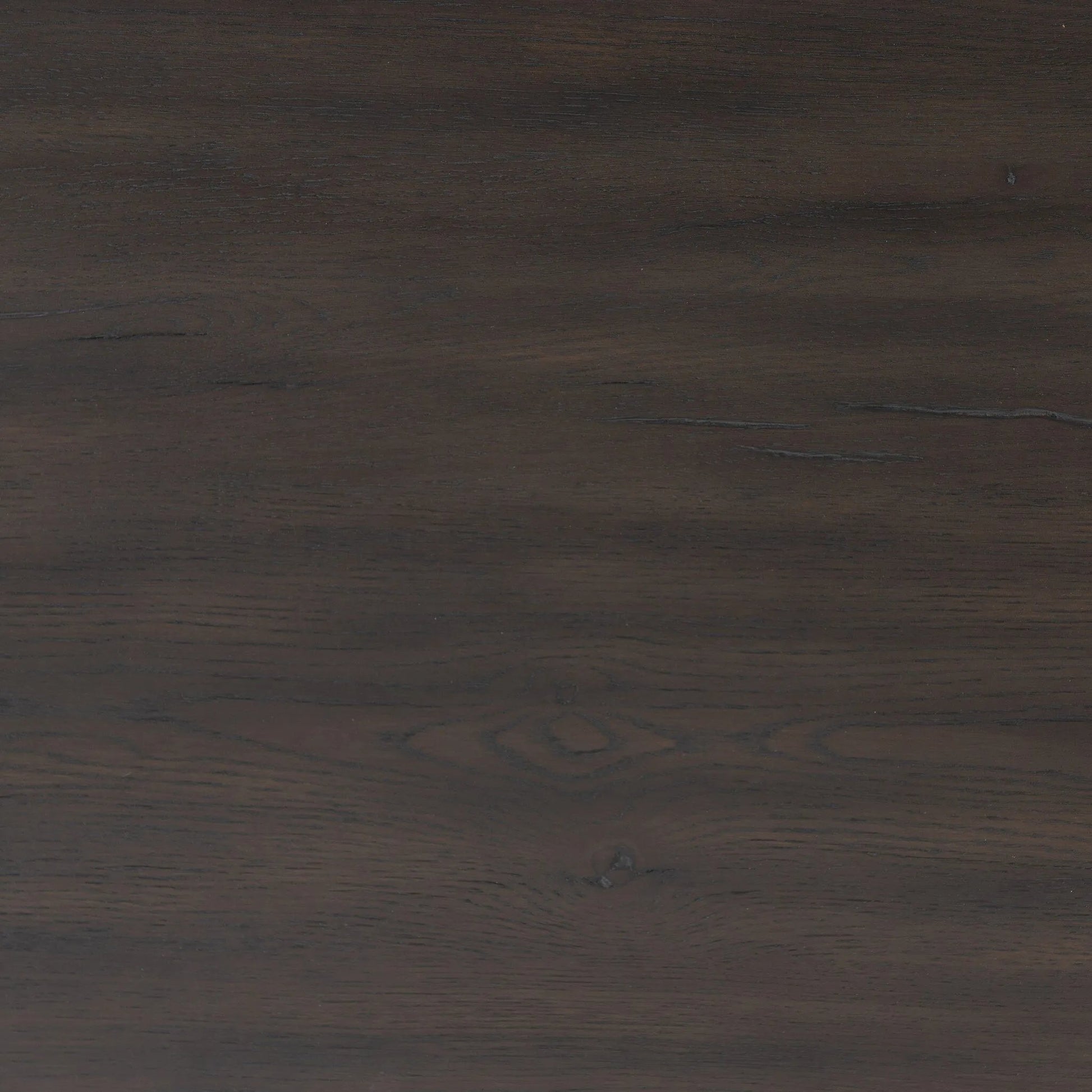 A substantially sized coffee table of smoked black oak features joint and connection construction for a design-forward look. Visible knots and graining add character.Collection: Haide Amethyst Home provides interior design, new home construction design consulting, vintage area rugs, and lighting in the Salt Lake City metro area.