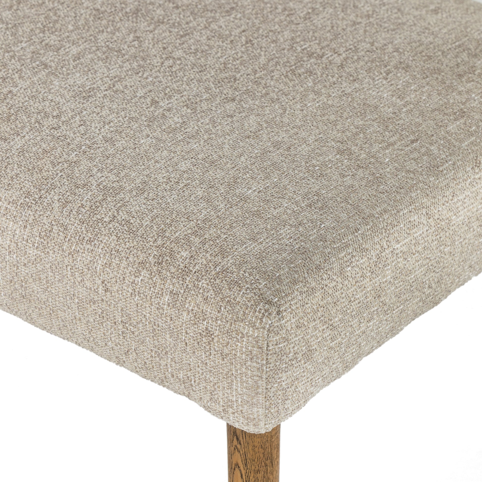 Simply styled and midcentury-minded, Joseph Light Camel Dining Bench is a textural light taupe upholstery that features a posterior cutout for added flair, with toasted nettlewood legs for natural contrast. Amethyst Home provides interior design services, furniture, rugs, and lighting in the Miami metro area. 