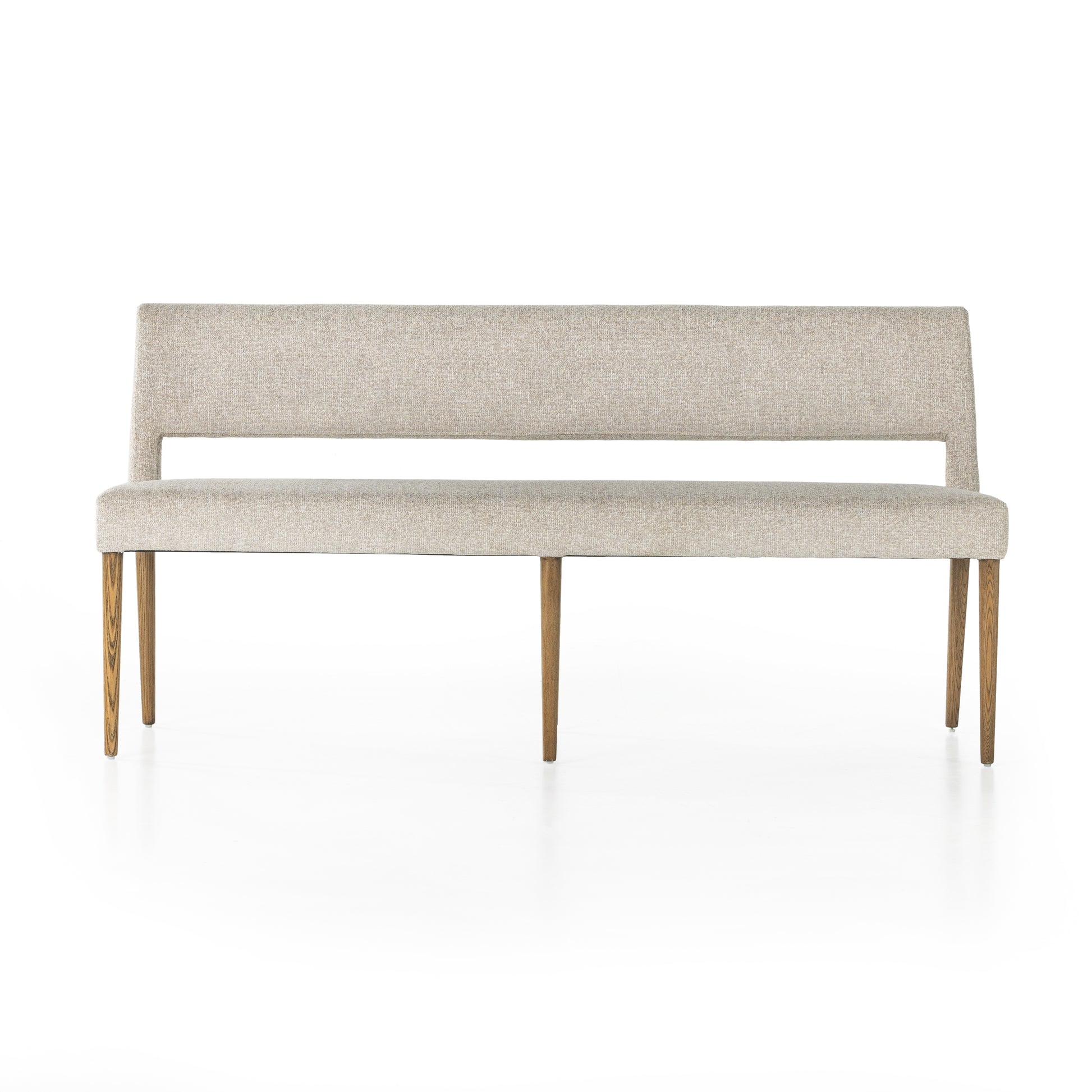 Simply styled and midcentury-minded, Joseph Light Camel Dining Bench is a textural light taupe upholstery that features a posterior cutout for added flair, with toasted nettlewood legs for natural contrast. Amethyst Home provides interior design services, furniture, rugs, and lighting in the Monterey metro area. 