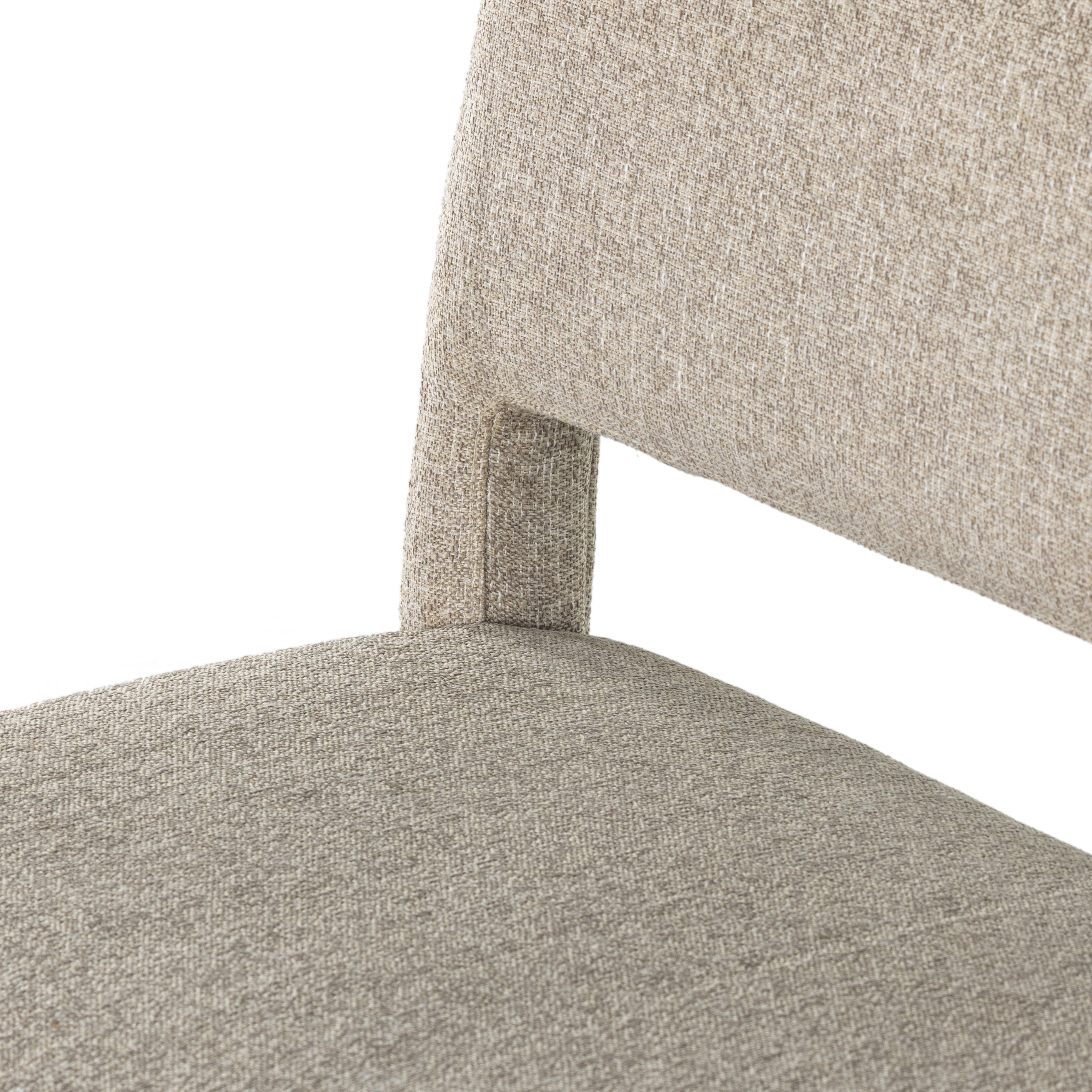 Simply styled and midcentury-minded, Joseph Light Camel Dining Bench is a textural light taupe upholstery that features a posterior cutout for added flair, with toasted nettlewood legs for natural contrast. Amethyst Home provides interior design services, furniture, rugs, and lighting in the Seattle metro area.
