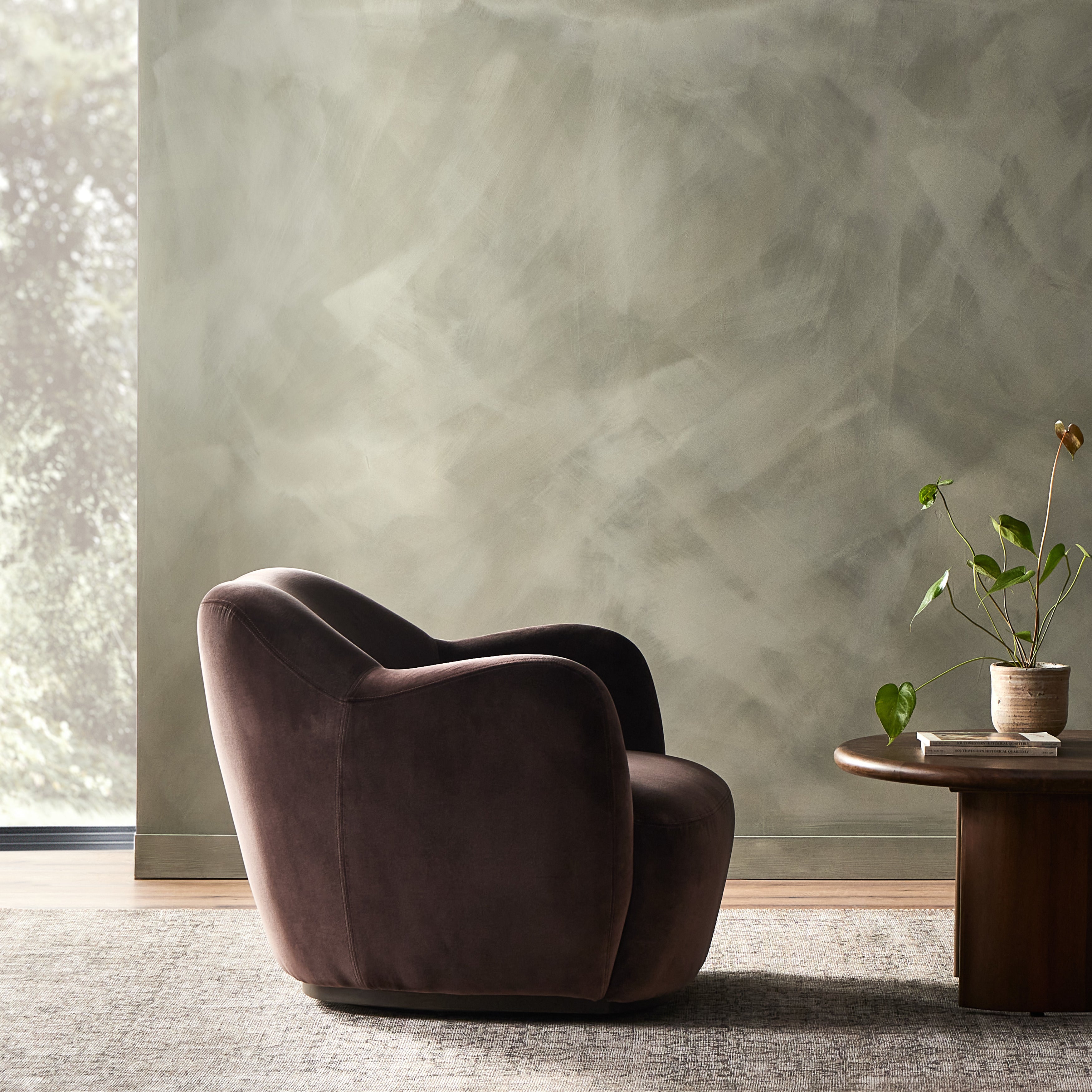 Velvety chocolate-brown upholstery pairs with an S-spring seat and enveloped frame for an inviting look and feel on this 360-degree swivel chair. Amethyst Home provides interior design, new construction, custom furniture, and area rugs in the Austin metro area.